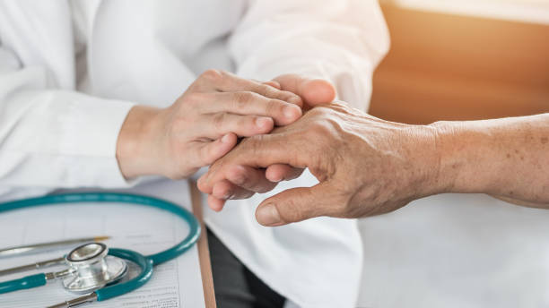 Elderly senior adult patient (older person) having geriatric doctor consulting and diagnostic examining on aging and mental health care in medical clinic office or hospital examination room